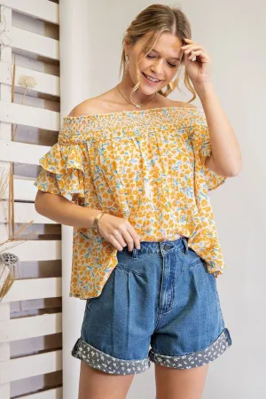 Off shoulder loose fit top with ruffled sleeves and smocked neckline