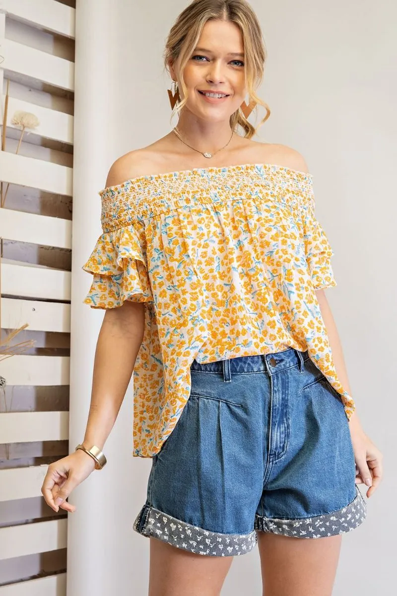 Off shoulder loose fit top with ruffled sleeves and smocked neckline